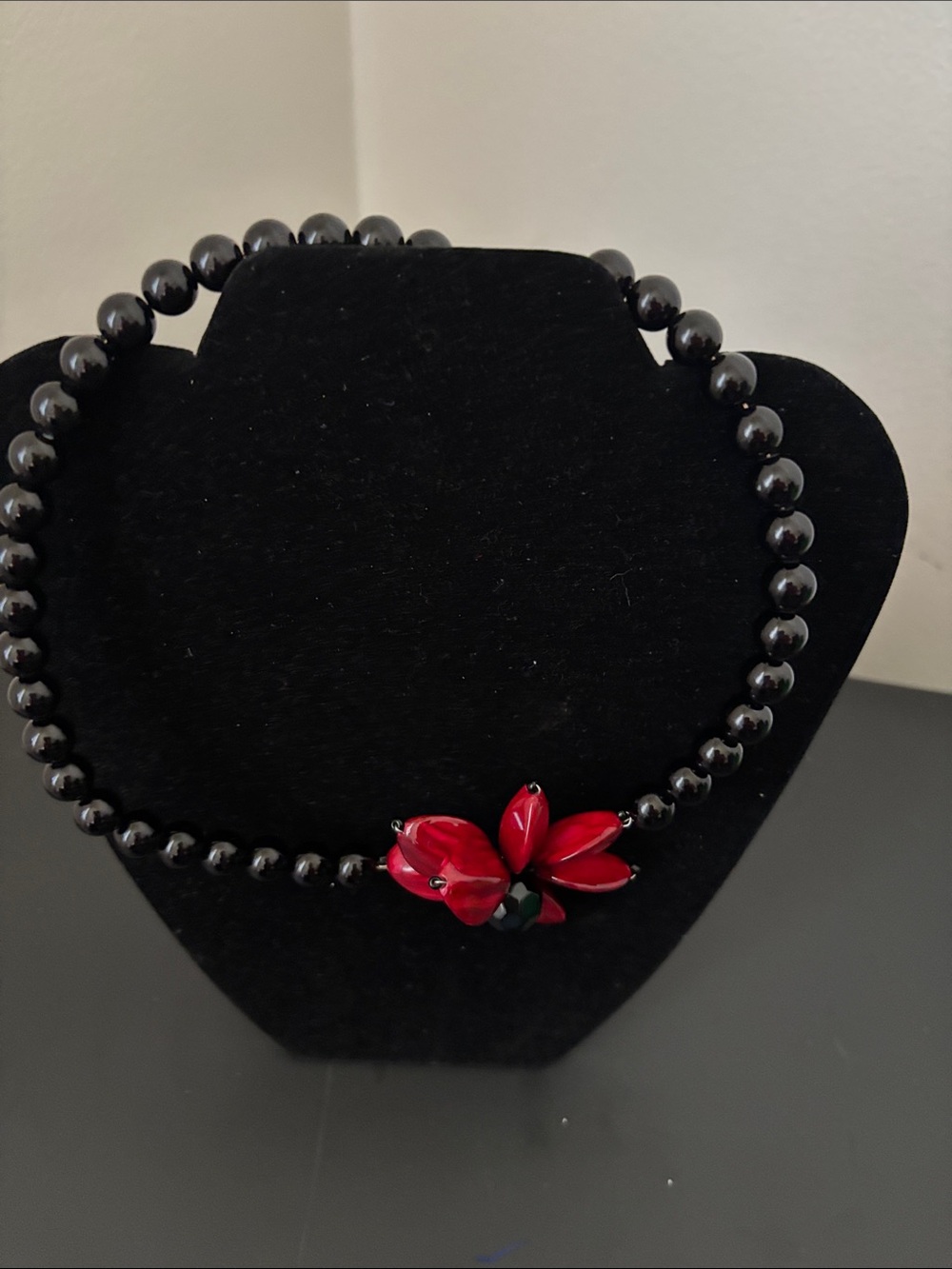 Black Beaded Necklace with Red Flower Accent